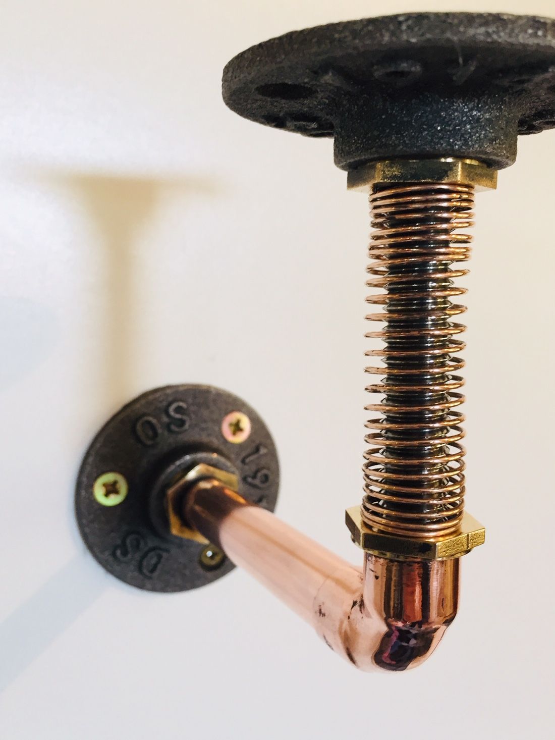 modern industrial copper shelf support with spring mechanism