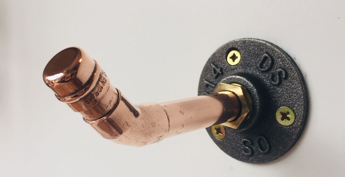 Industrial style copper shelf bracket with a foot